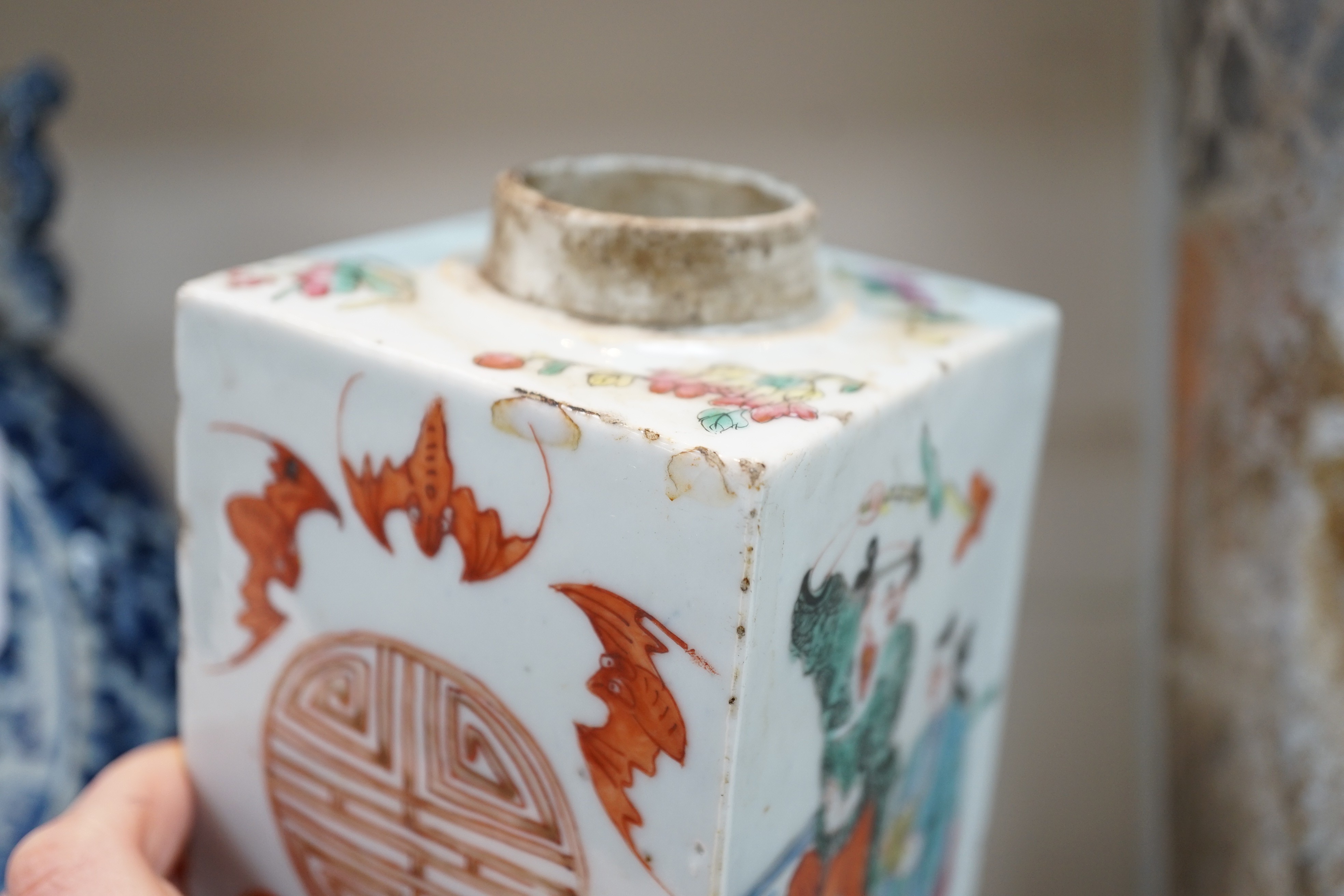 A Chinese famille rose square tea caddy, mid 19th century, 13.7cm high excluding wood stand and cover, slight damage